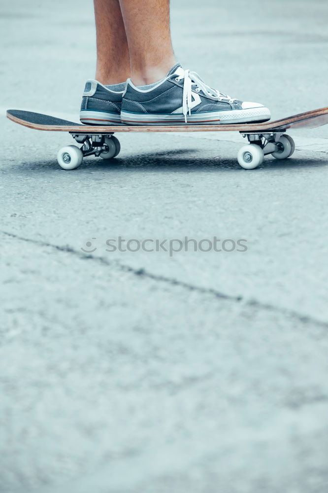 Similar – Person rides the skateboard