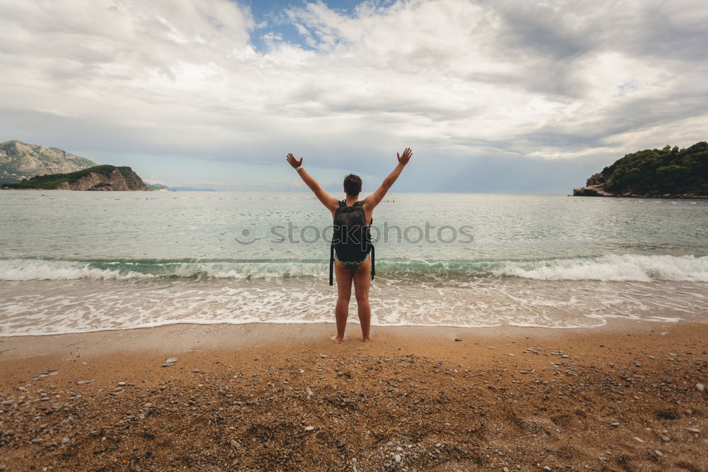 Similar – Man standing on beach Sand