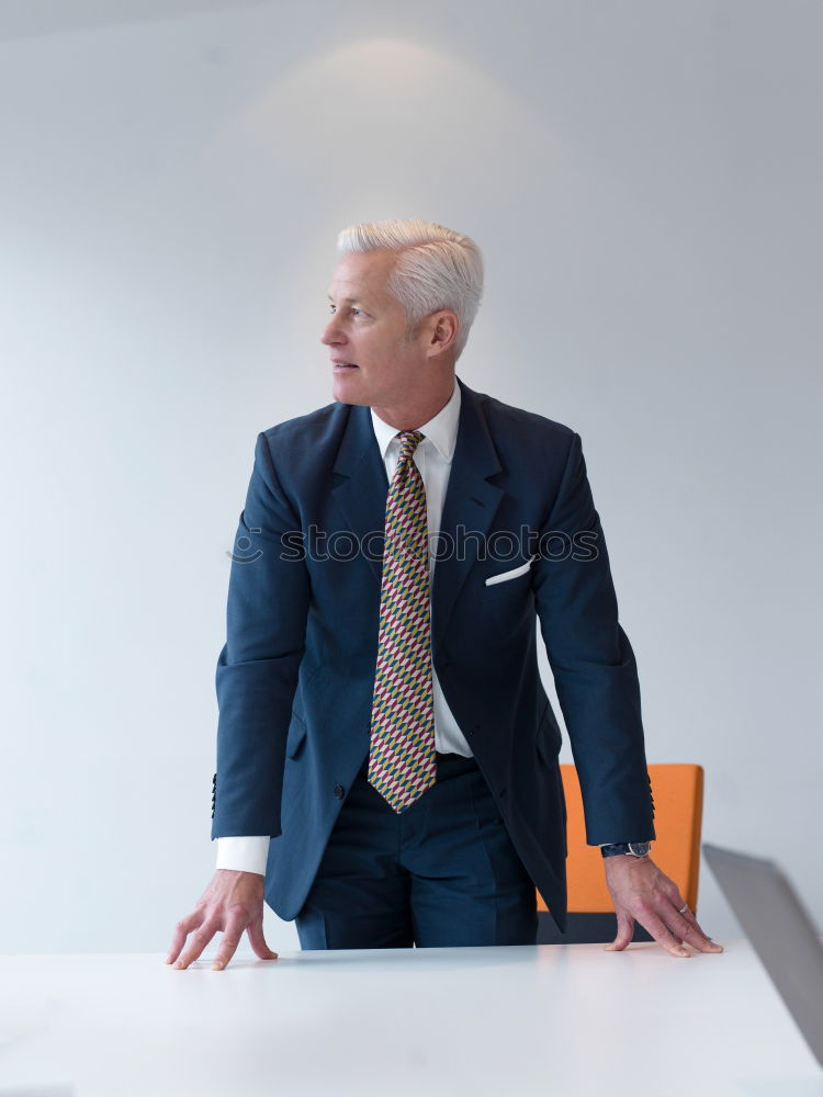 Similar – Image, Stock Photo Senior businessman walking outside of modern office building.