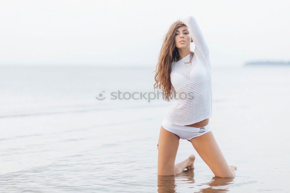 Similar – Beautiful young black woman sitting in a  wooden foot bridge at the beach