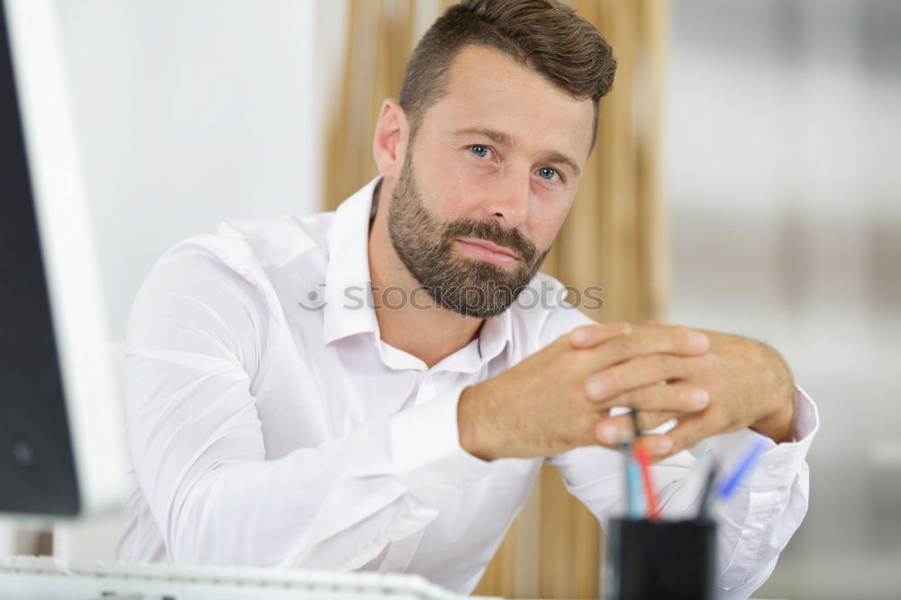 Similar – Bearded man in sunglasses looking at the window