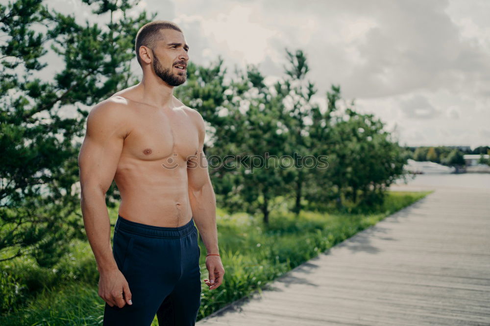 Similar – Image, Stock Photo tough muscular man is doing stretching at railing to beach