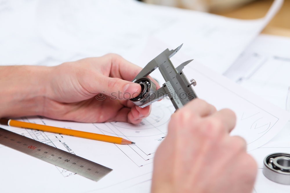 Similar – Image, Stock Photo Architect or planner working on drawings for construction