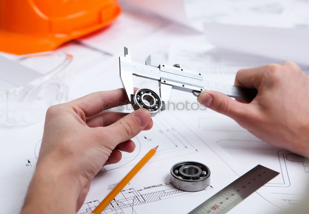 Similar – Image, Stock Photo Architect or planner working on drawings for construction