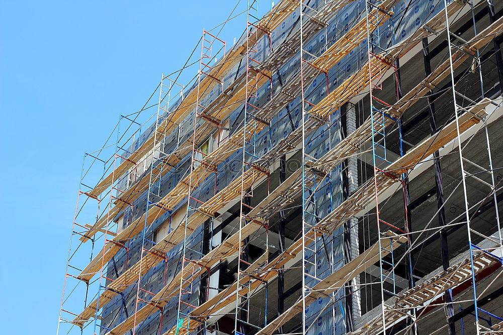 Similar – Foto Bild Bauzaun aus Holz vor dem Neubau eines Wohnhaus mit Baugerüst am ehemaligen Hafen in Offenbach am Main in Hessen