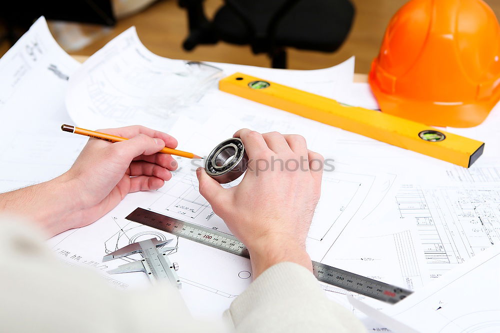 Similar – Image, Stock Photo Architect or planner working on drawings for construction