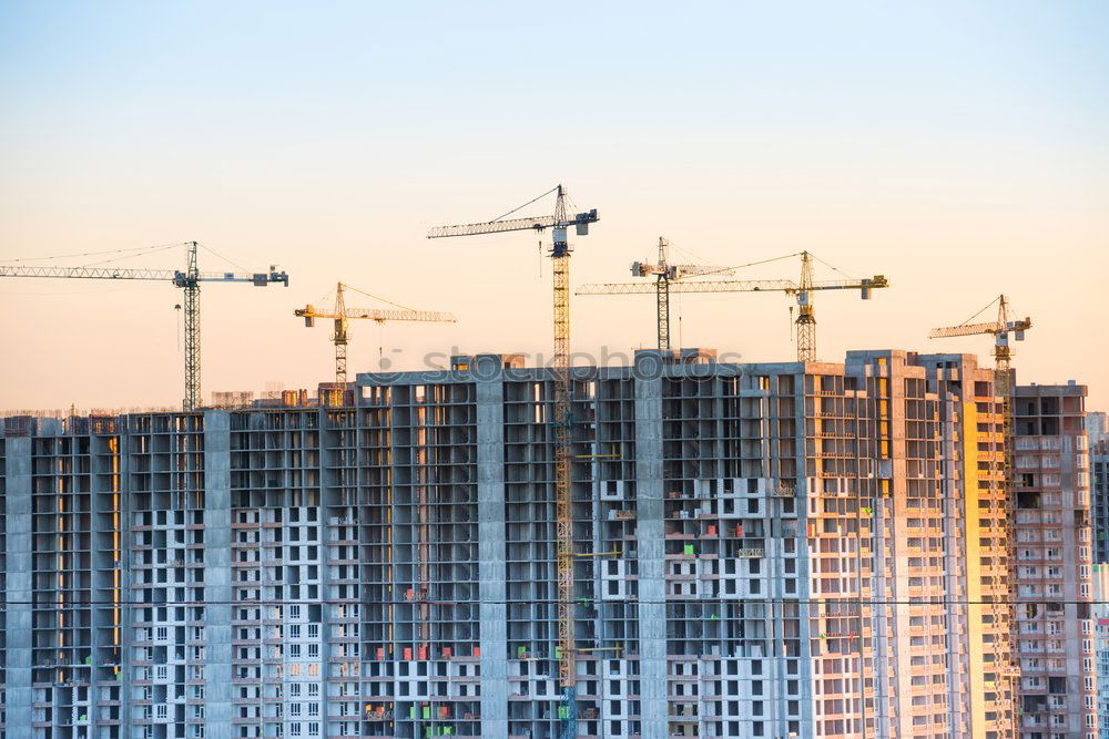 Similar – Construction site with building cranes