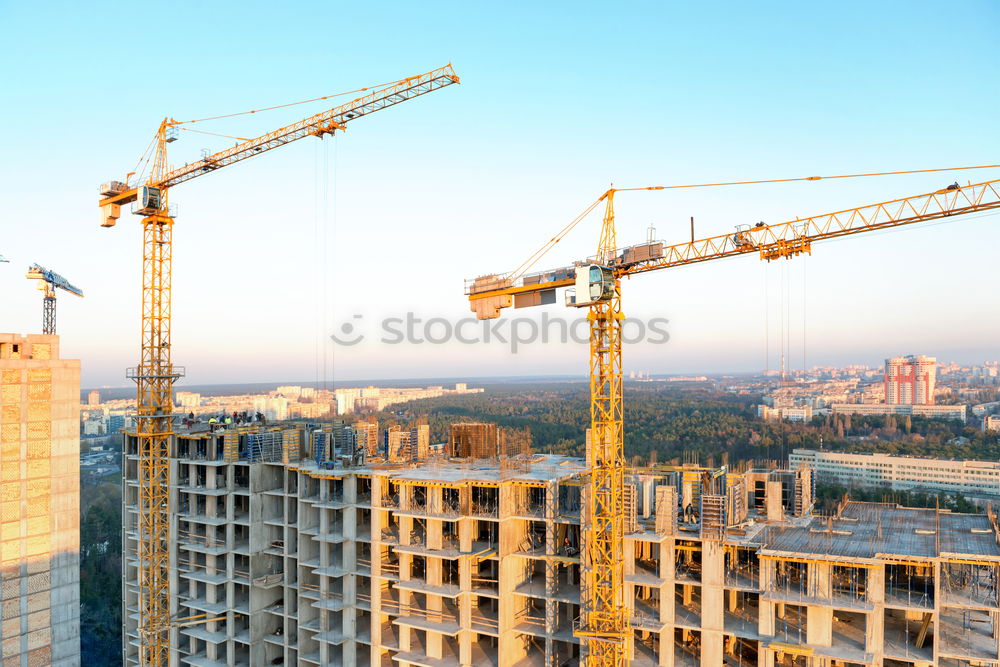 Similar – Construction site with building cranes