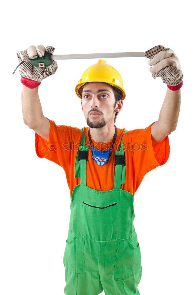 Similar – Worker man with hammer drill and building level at construction site