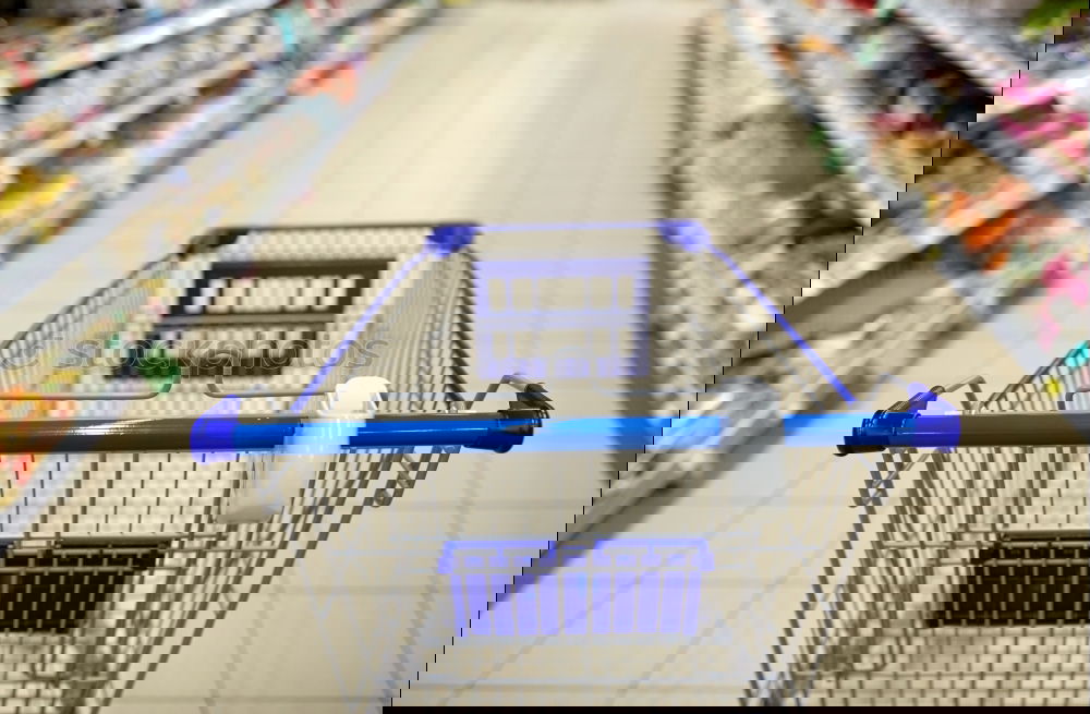 Similar – Image, Stock Photo Empty shopping cart in the supermarket corridor