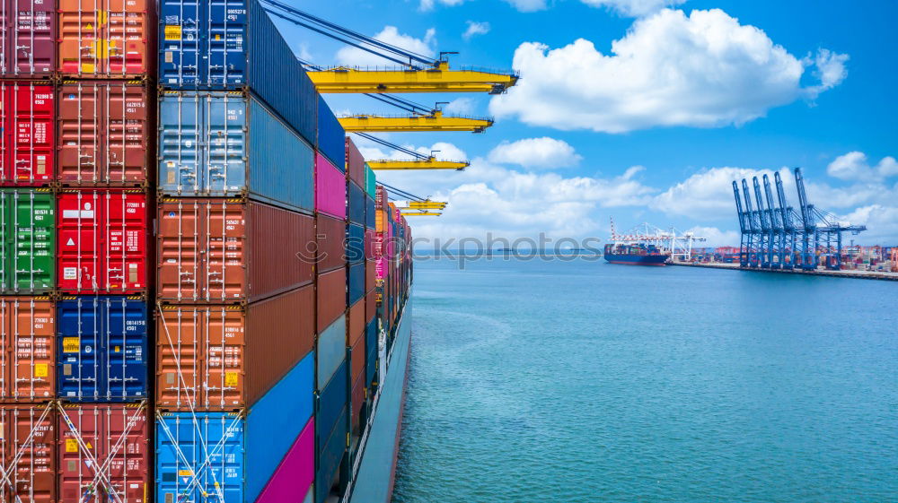 Similar – Container ship unloading in deep sea port, Global business logistic import export freight shipping transportation oversea worldwide by container ship in open sea, Container vessel loading cargo freight ship.