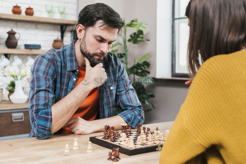 Similar – child girl playing checkers with dad