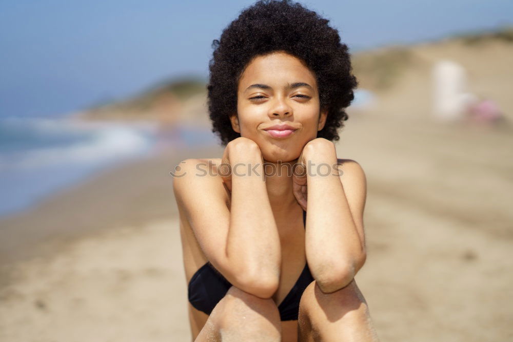 Similar – Image, Stock Photo Beautiful young black woman lying down in a  wooden foot bridge at the beach