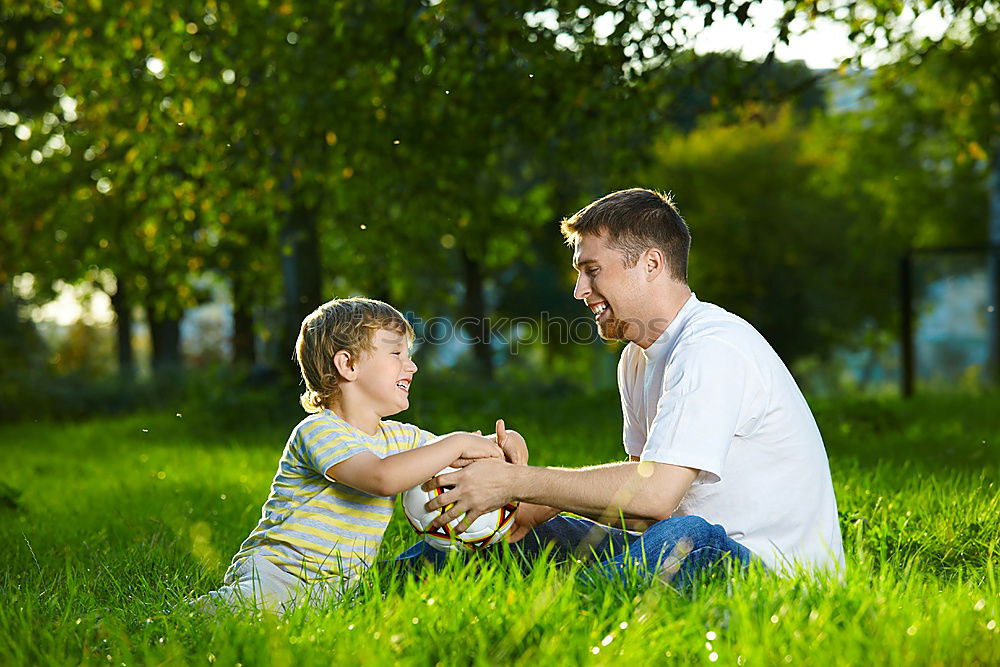Similar – Image, Stock Photo Cheerful young man teaching his son to play mini golf