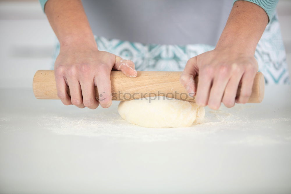 Similar – woman kneading bread dough with her hands