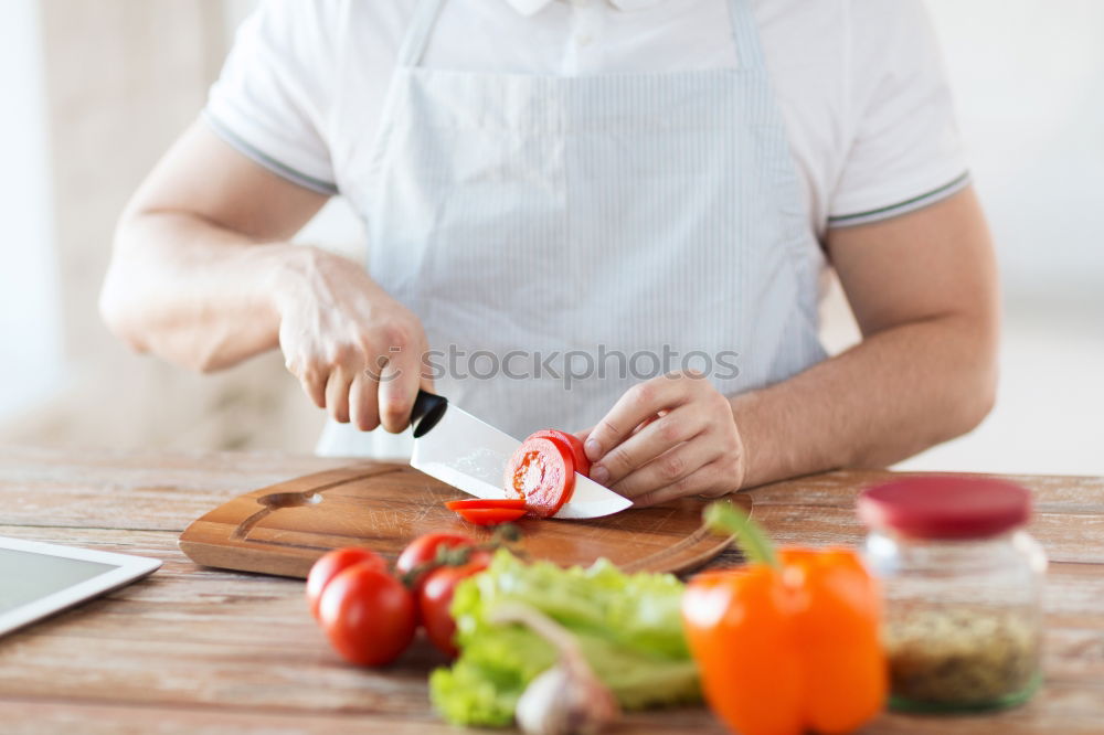 Similar – Young couple cooking. Man and woman in their kitchen