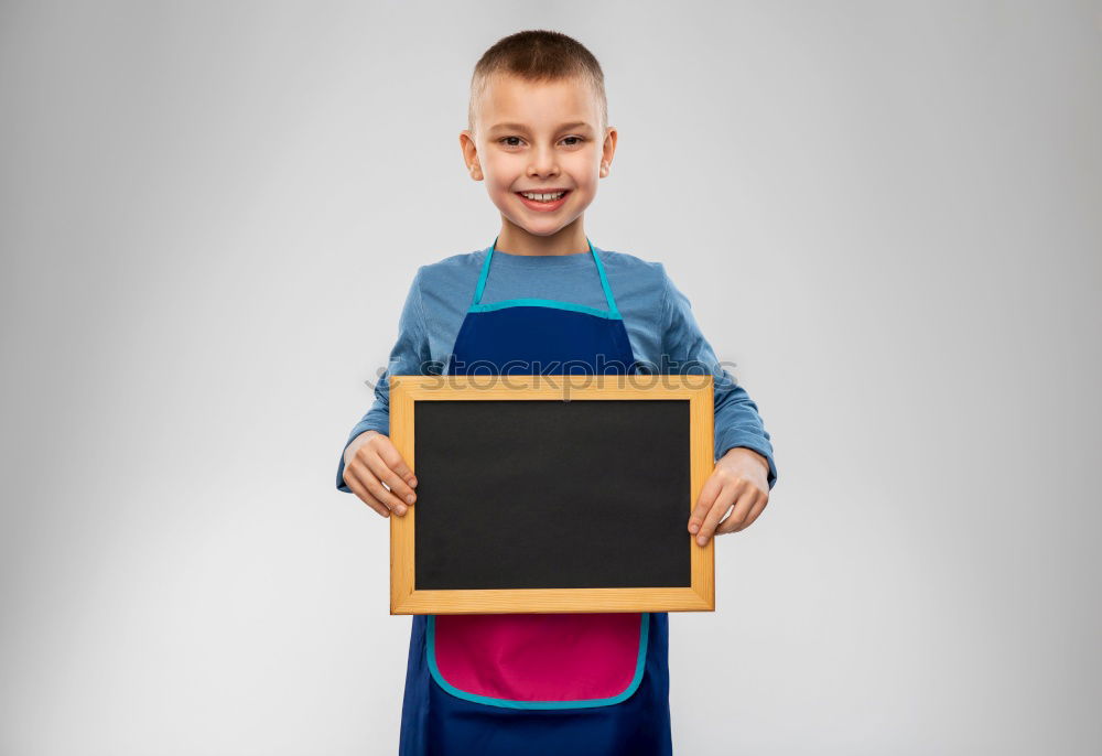 Similar – Image, Stock Photo smiling child holding a blackboard