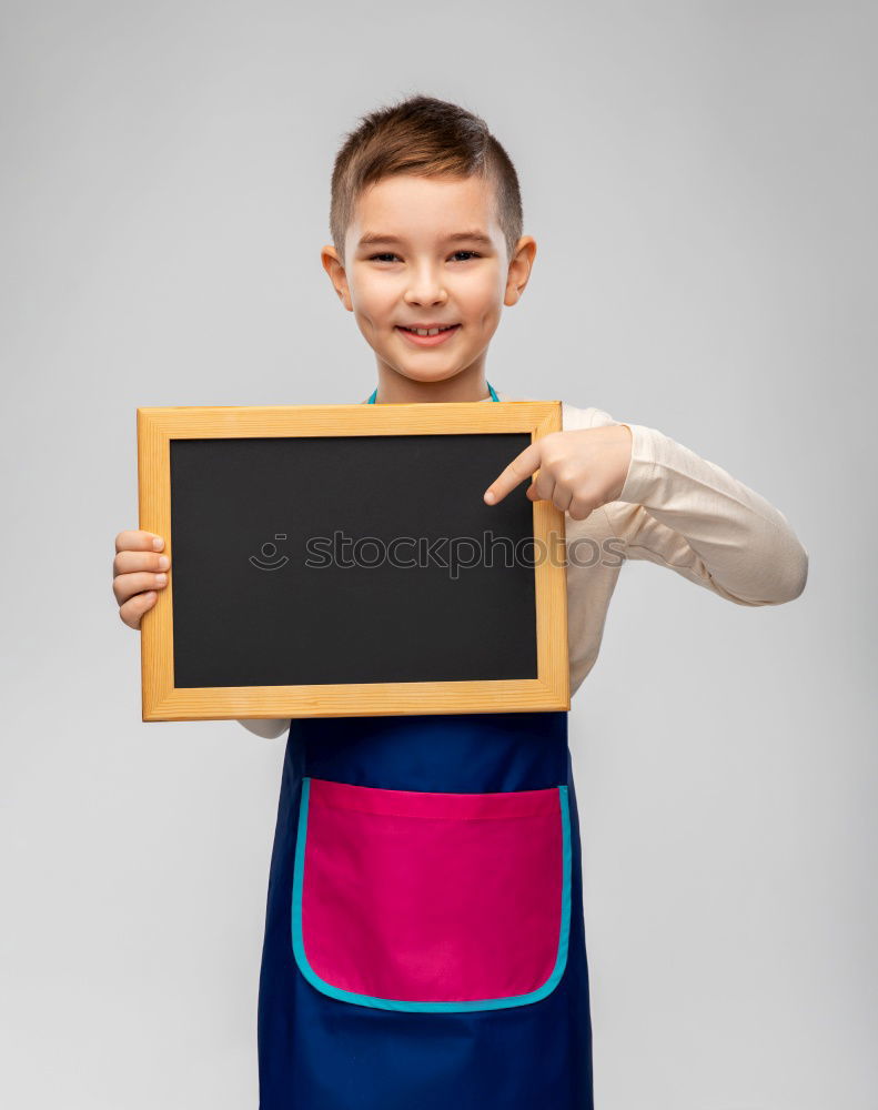 Similar – Image, Stock Photo smiling child holding a blackboard