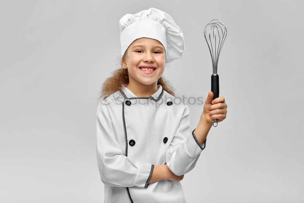 Similar – senior woman with cook hat and rolling pin and spatula on gray background