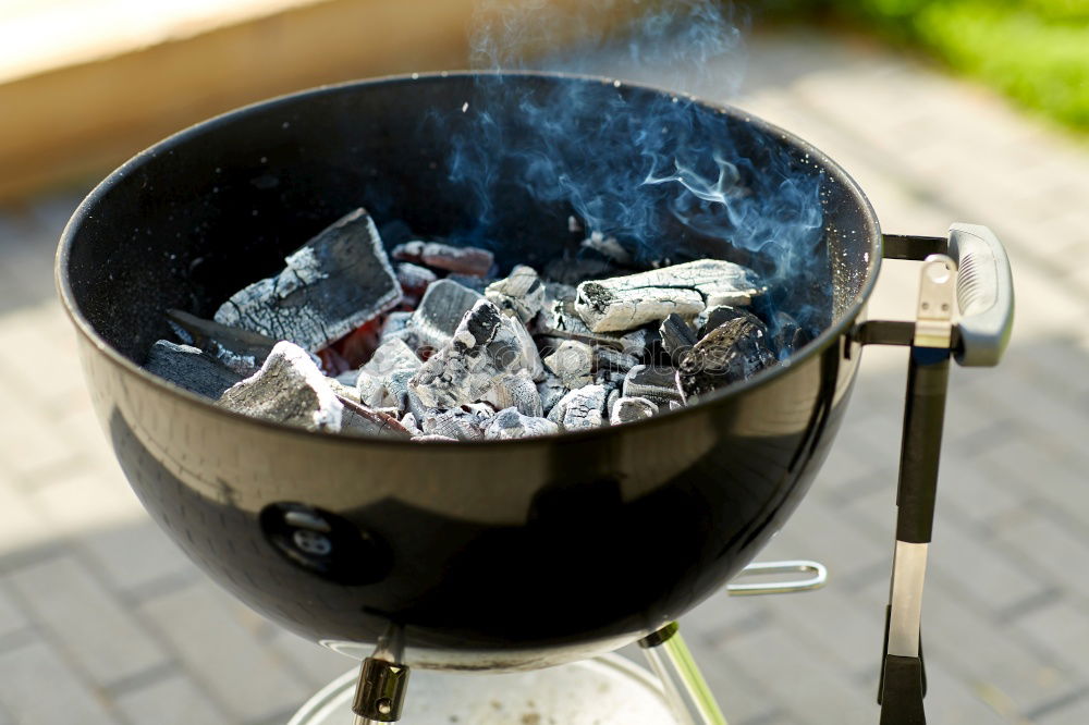 Similar – Hot coals with smoke in grill