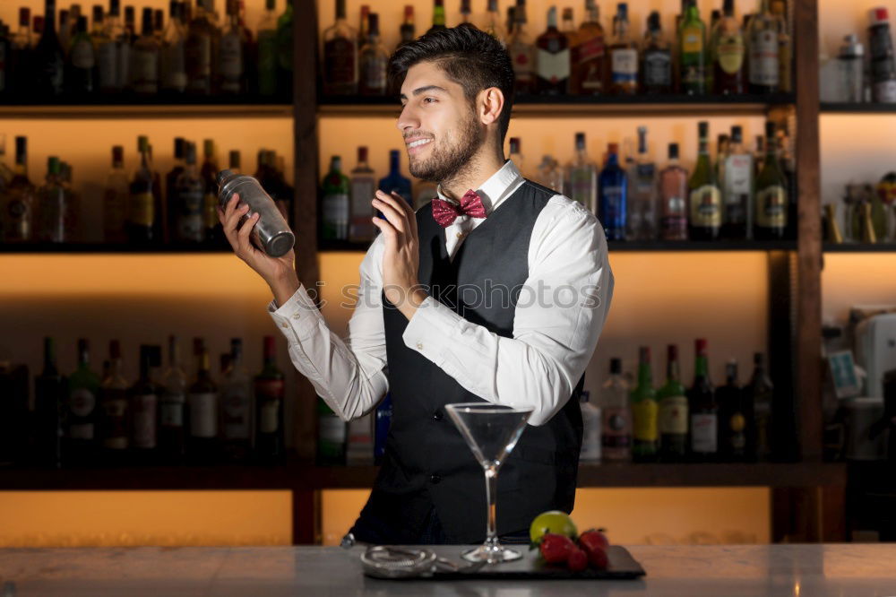 Similar – Barman is making cocktail at night club.