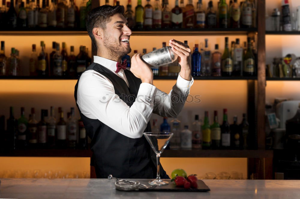 Similar – Barman is making cocktail at night club.