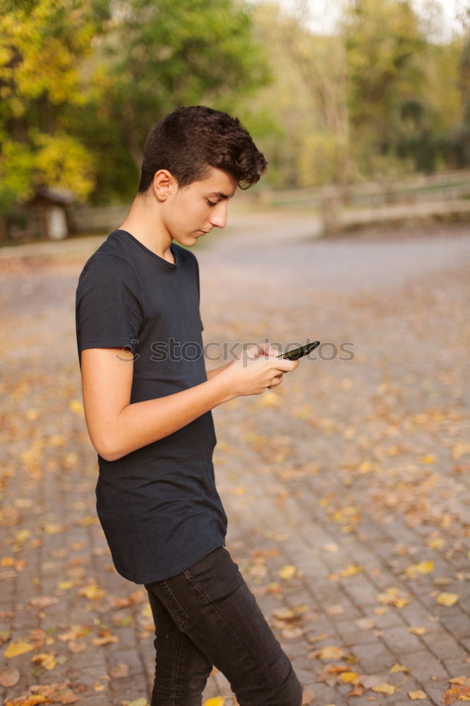 Similar – Image, Stock Photo Young urban man using smartphone in urban background.