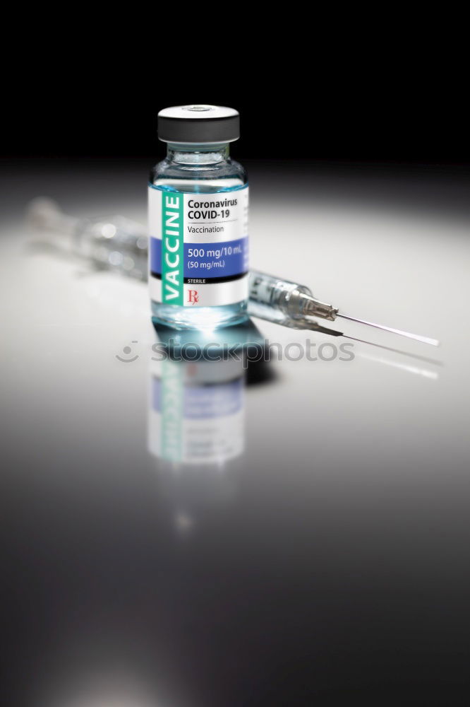 Similar – Small bottle of medicine and syringe on blue background