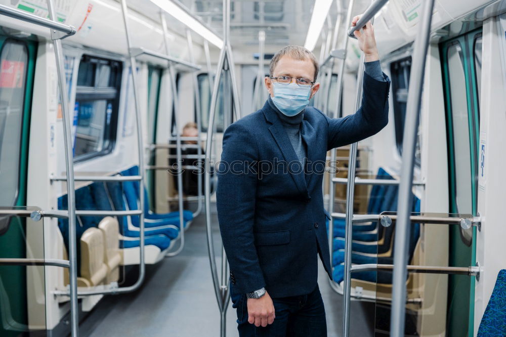 Similar – Image, Stock Photo Young woman with face mask and dog traveling by train.Train travel during pandemic