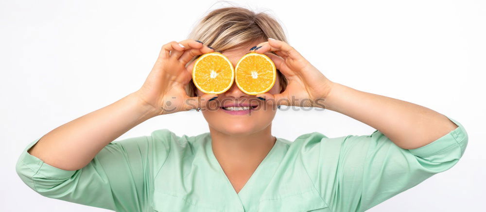 Similar – smiling little girl holding oranges over her eyes