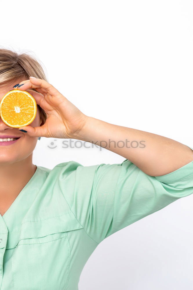 Similar – smiling little girl holding oranges over her eyes