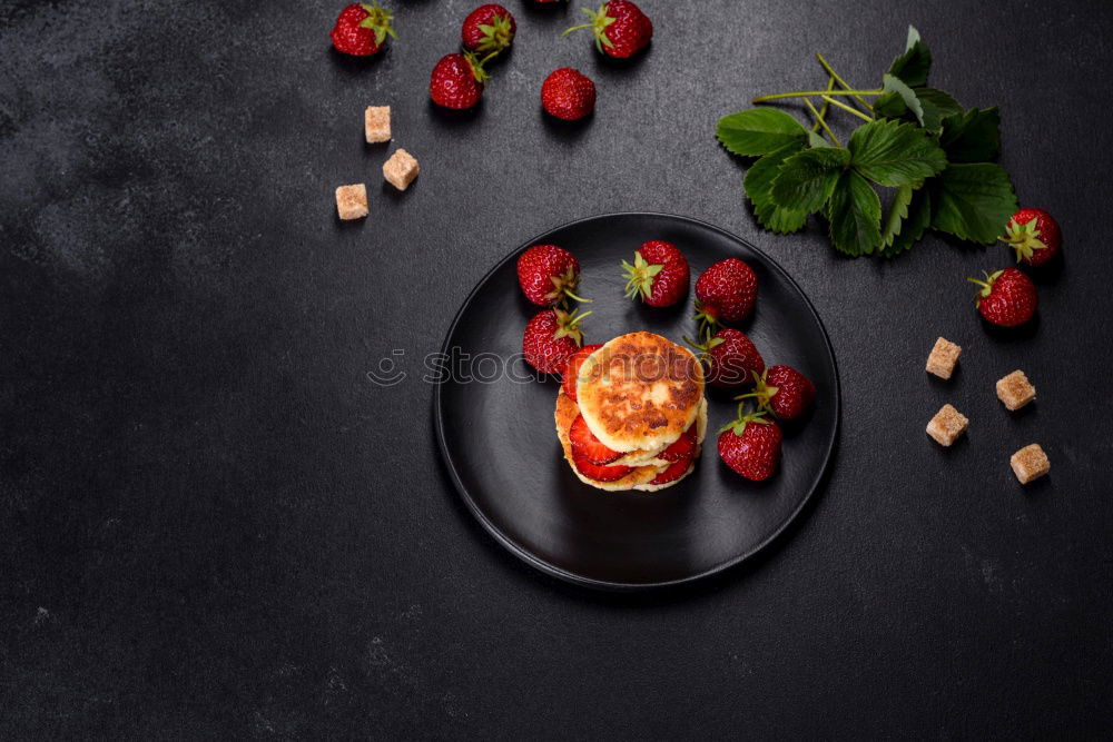 Similar – Image, Stock Photo Tasty strawberries in black colander bowl on dark rustic kitchen table. Copy space. Seasonal organic food. Healthy eating and cooking