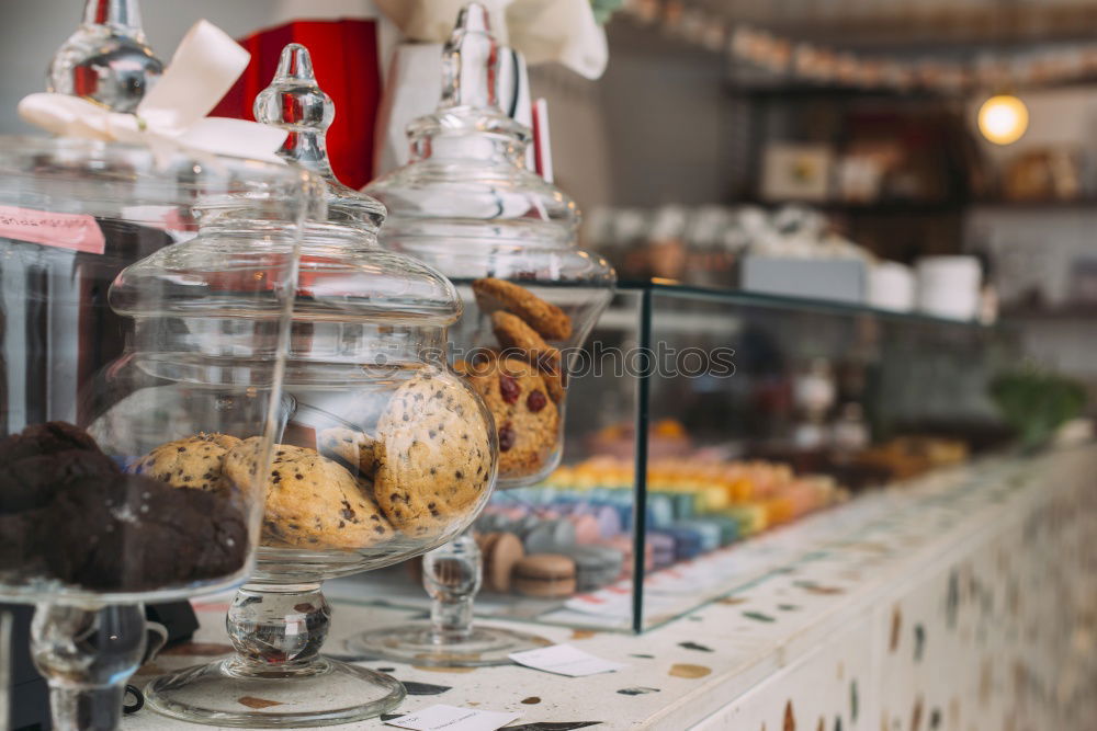 Glass jars with dried fruits in a supermarket without packaging