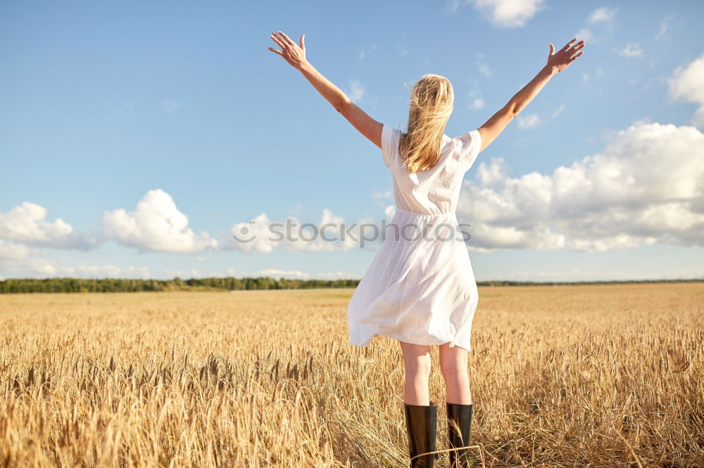 Similar – Image, Stock Photo Back view of a young woman in nature in a sunny autumn day