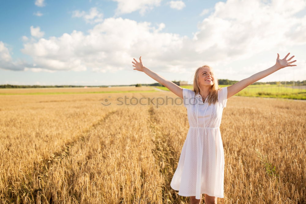 Similar – Image, Stock Photo Back view of a young woman in nature in a sunny autumn day