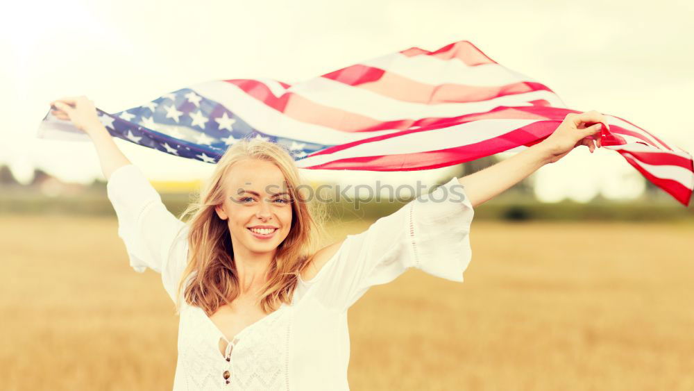 Similar – Teenage girls holding USA flag outdoor