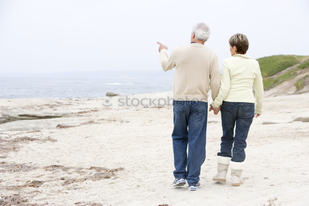 Similar – Grandfather With His grandson on the lake. Back view