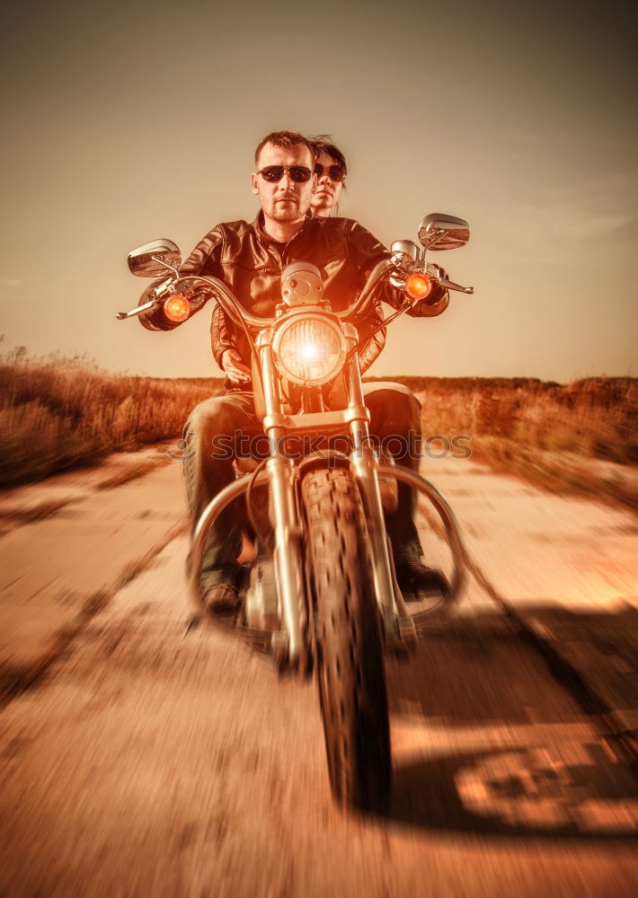 Similar – Man on bike looking away