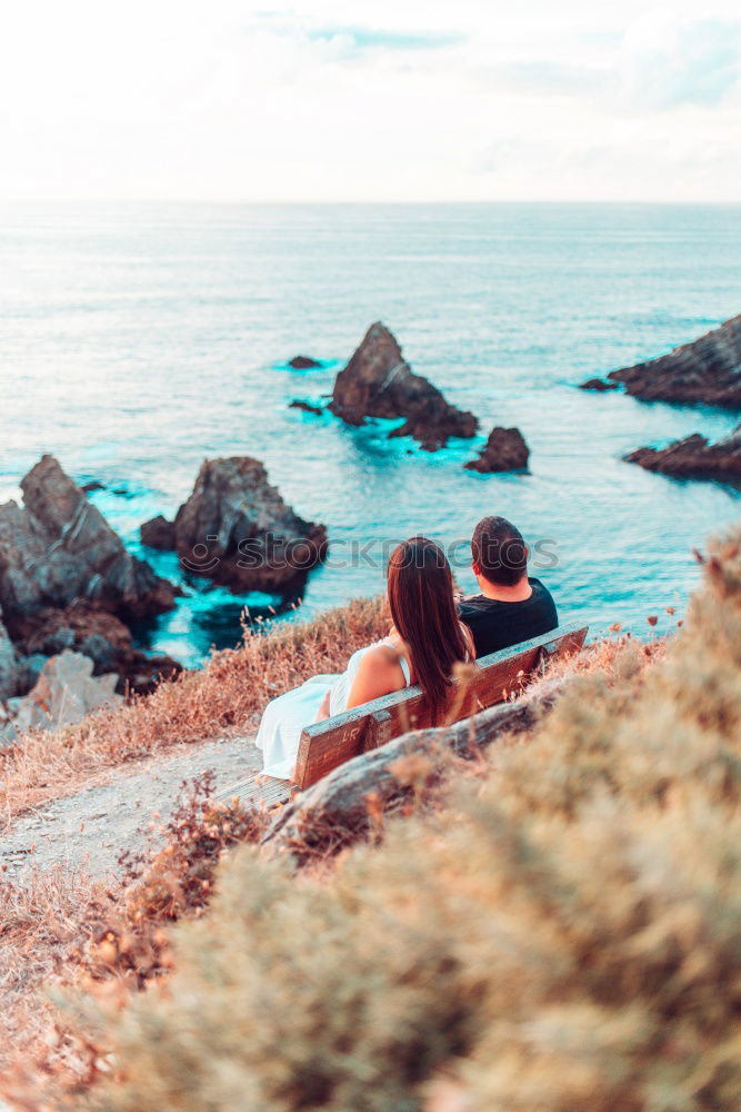 Similar – Image, Stock Photo Men standing on cliff at ocean