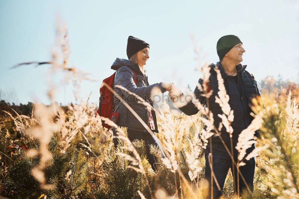 Similar – Image, Stock Photo Couple pausing while doing trekking