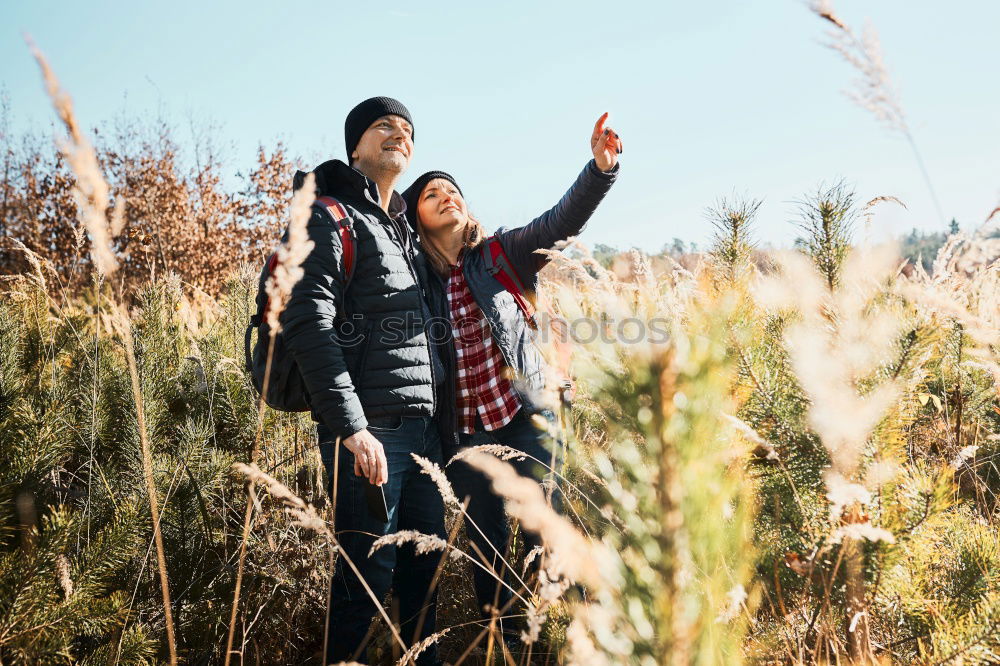 Similar – Elferly fit happy couple hiking through forest together on vacation