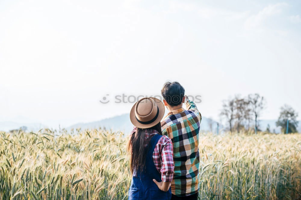 Similar – Person on cliff taking photo