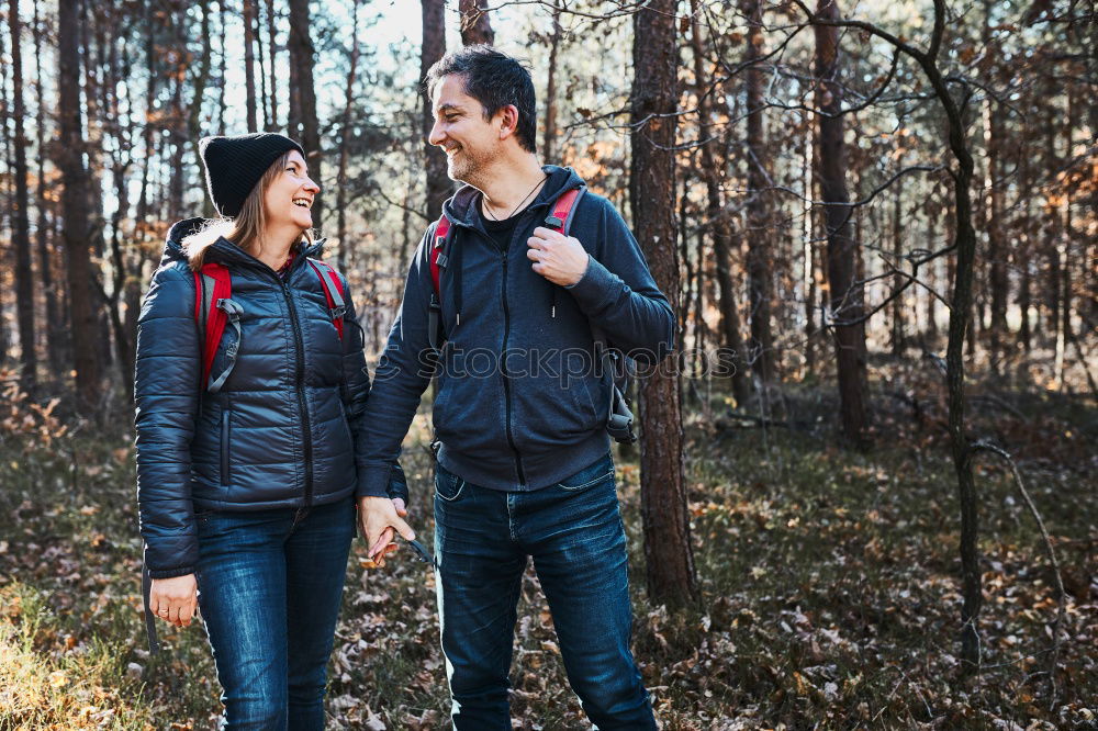 Similar – Image, Stock Photo Couple pausing while doing trekking