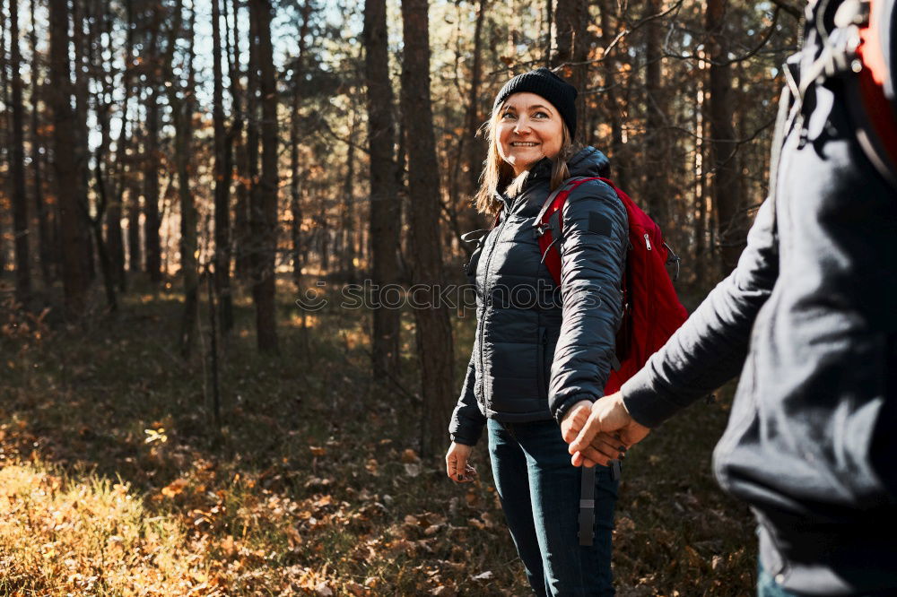 Similar – Image, Stock Photo Couple pausing while doing trekking