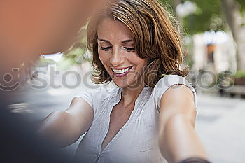 Image, Stock Photo Smiling young woman recording voice note in her smart phone