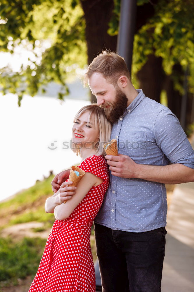 Similar – Image, Stock Photo Young smiling couple on a path in the park.