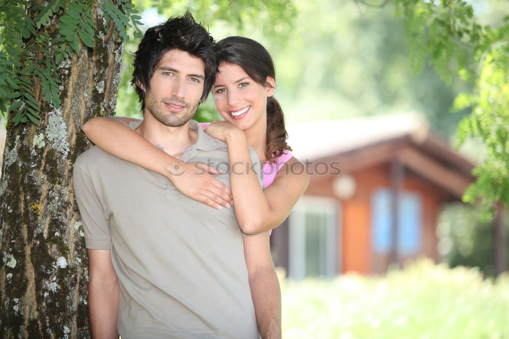 Image, Stock Photo Beautiful young couple laying on grass in an urban park