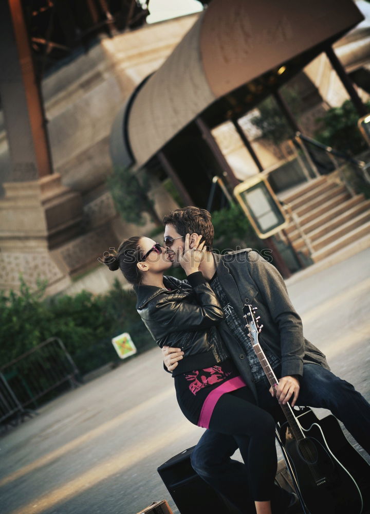 Similar – Couple embracing on evening street