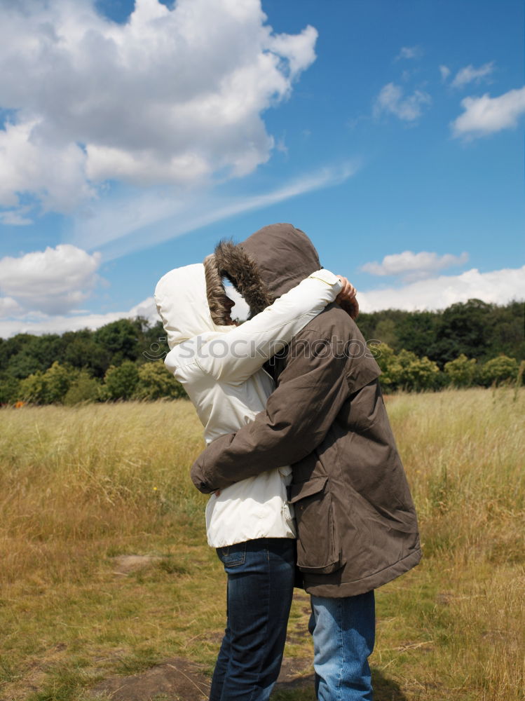 Similar – A couple of happy young people hug each other