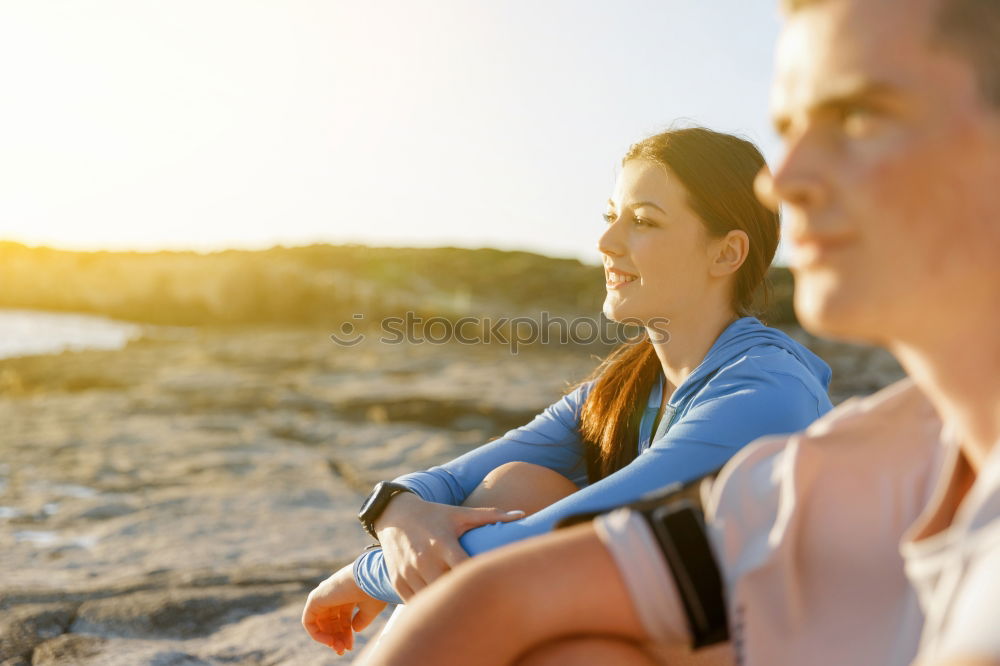 Similar – Image, Stock Photo Smiling young woman and man sitting on a pier over the sea